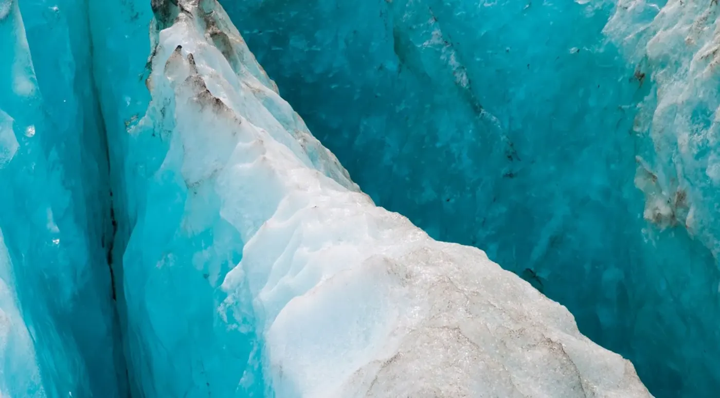 Deep blue ice in a glacier crevasse
