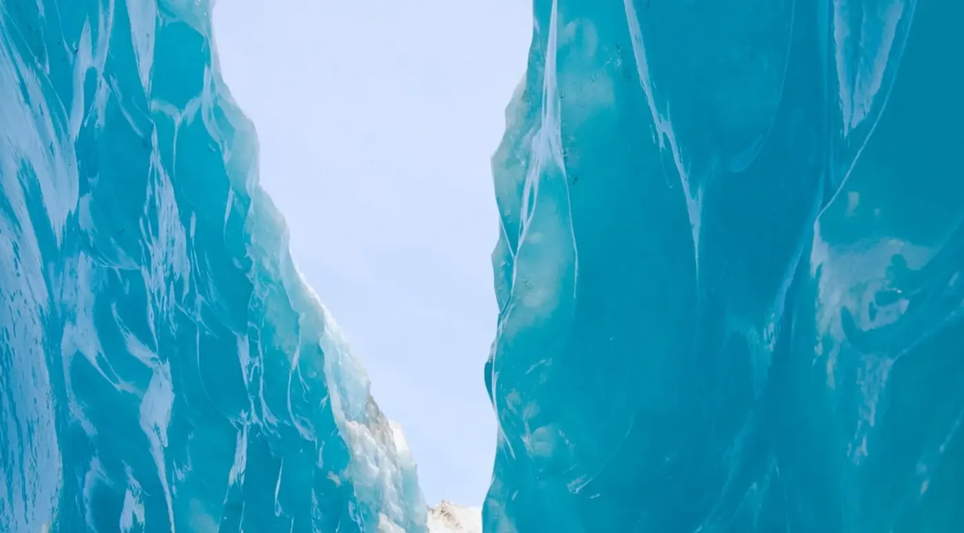 Blue ice walls framing a narrow passage