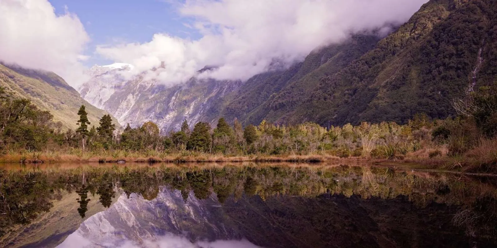 Mountain reflections in a small valley lake