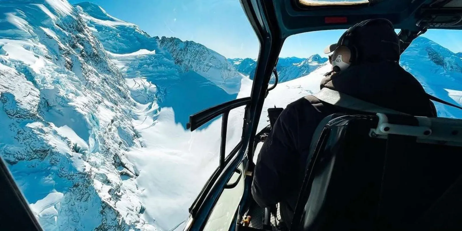 View of the glacier through a helicopter cockpit