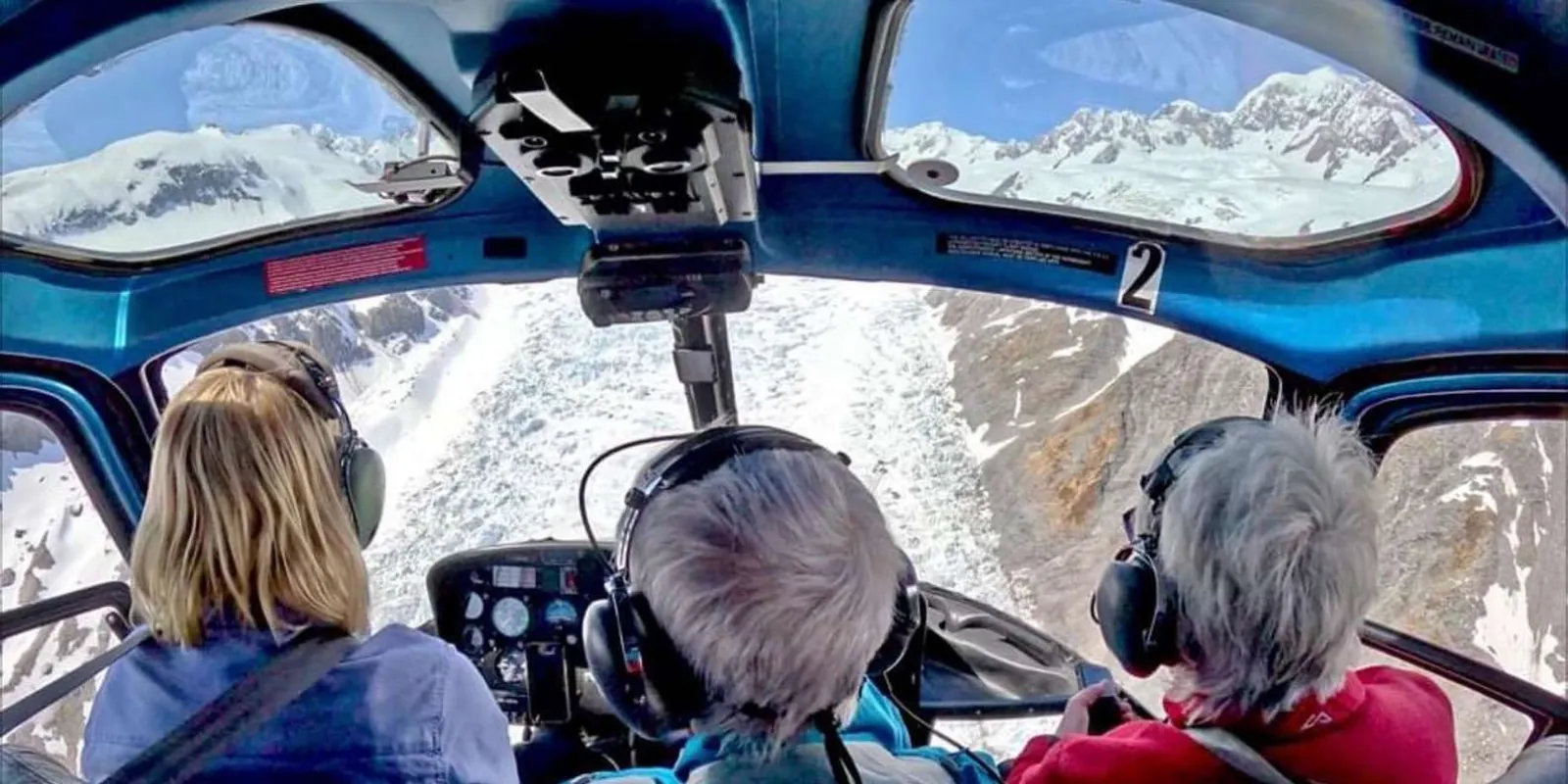 Passengers viewing the glacier through the cockpit