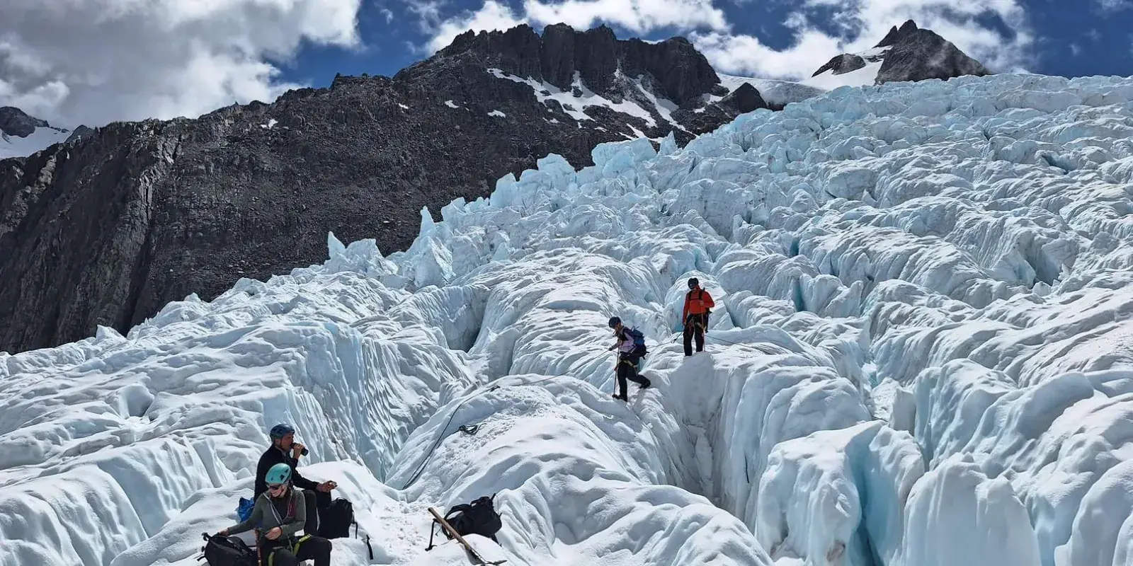 Hikers among closely packed ice pinnacles